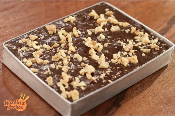 Pour the fudge into the prepared baking dish