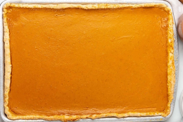 pumpkin filling over the baked crust